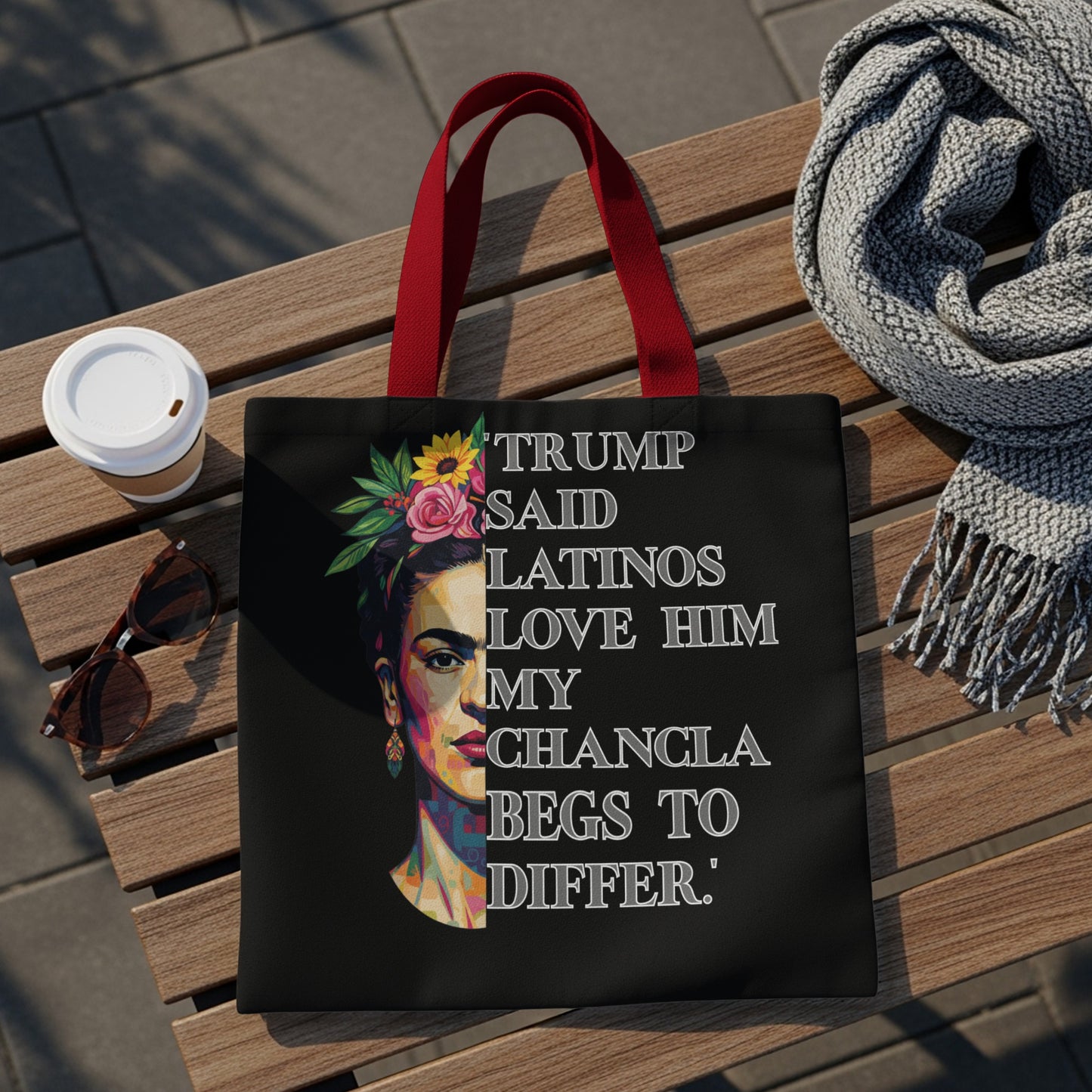 Tote bag with Frida Kahlo portrait and text saying "Trump said Latinos love him my chancla begs to differ."