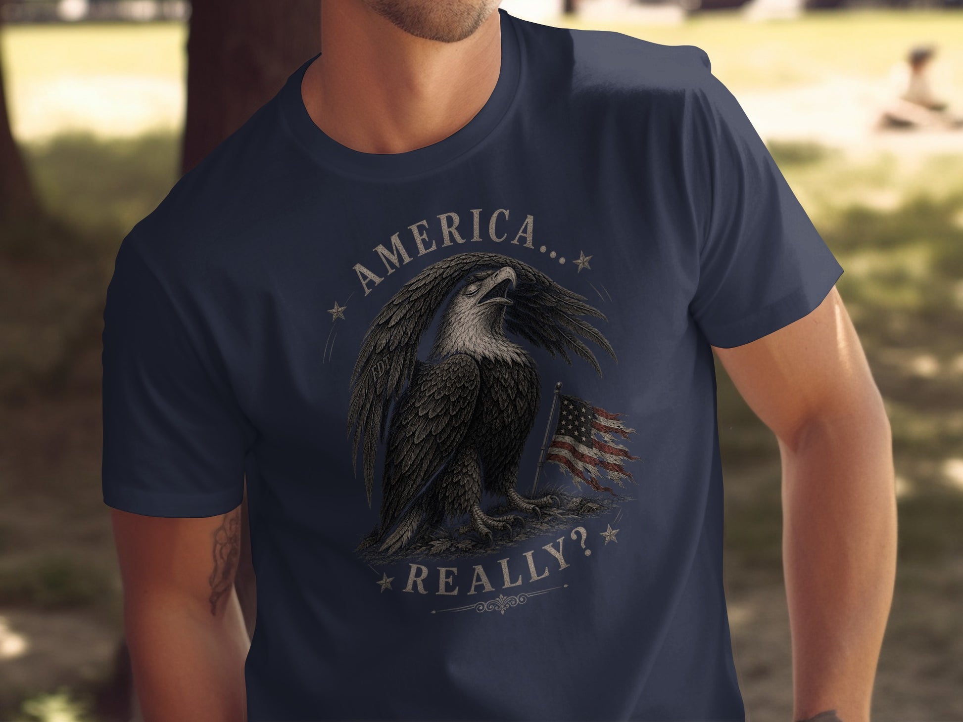 Eagle with American flag and text "AMERICA... REALLY?" on navy t-shirt.
