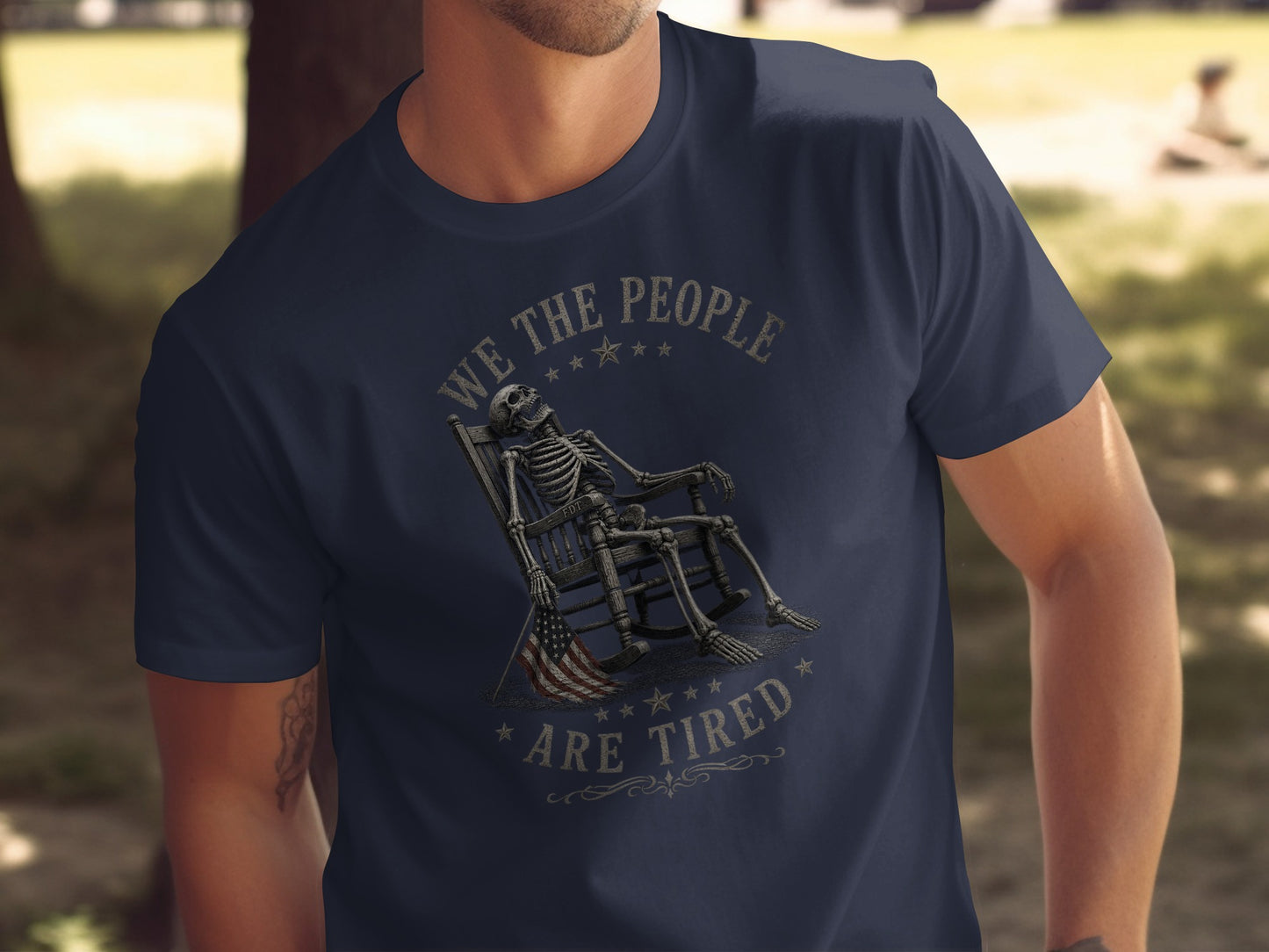 Skeleton in rocking chair, "We the people are tired" text, American flag.