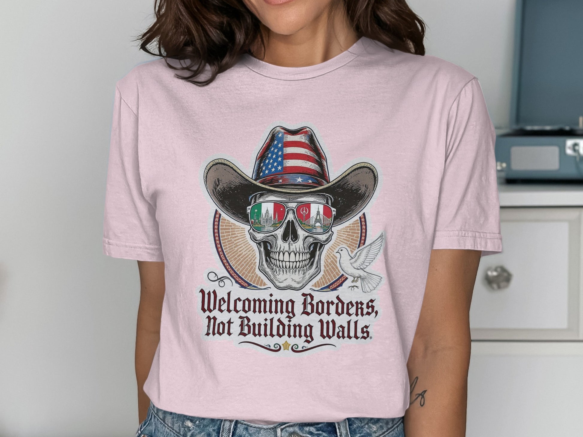 Welcoming Borders Not Building Walls Graphic Tee product