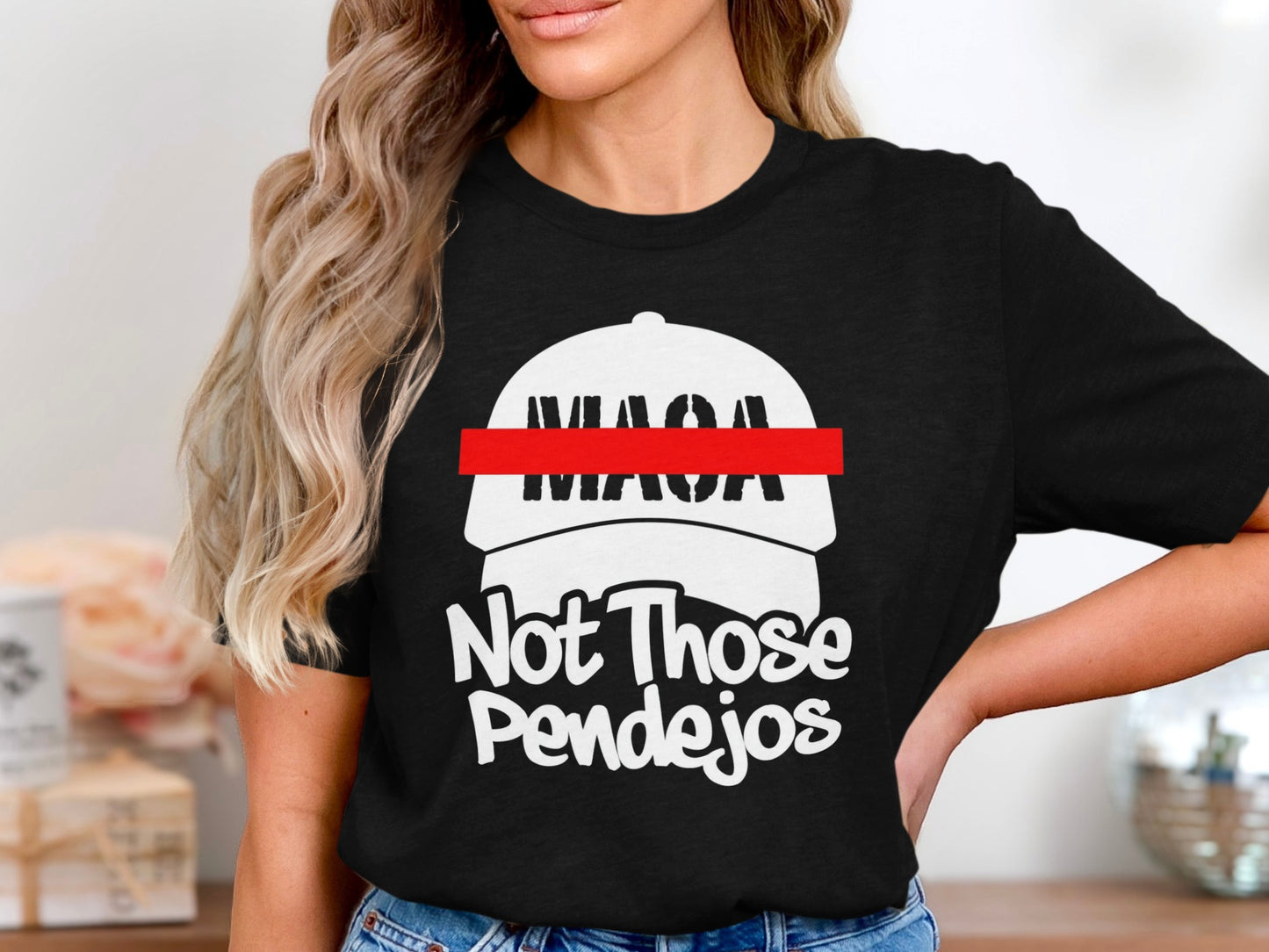 Black t-shirt with white text and hat graphic: "MAGA", red line, "Not Those Pendejos".