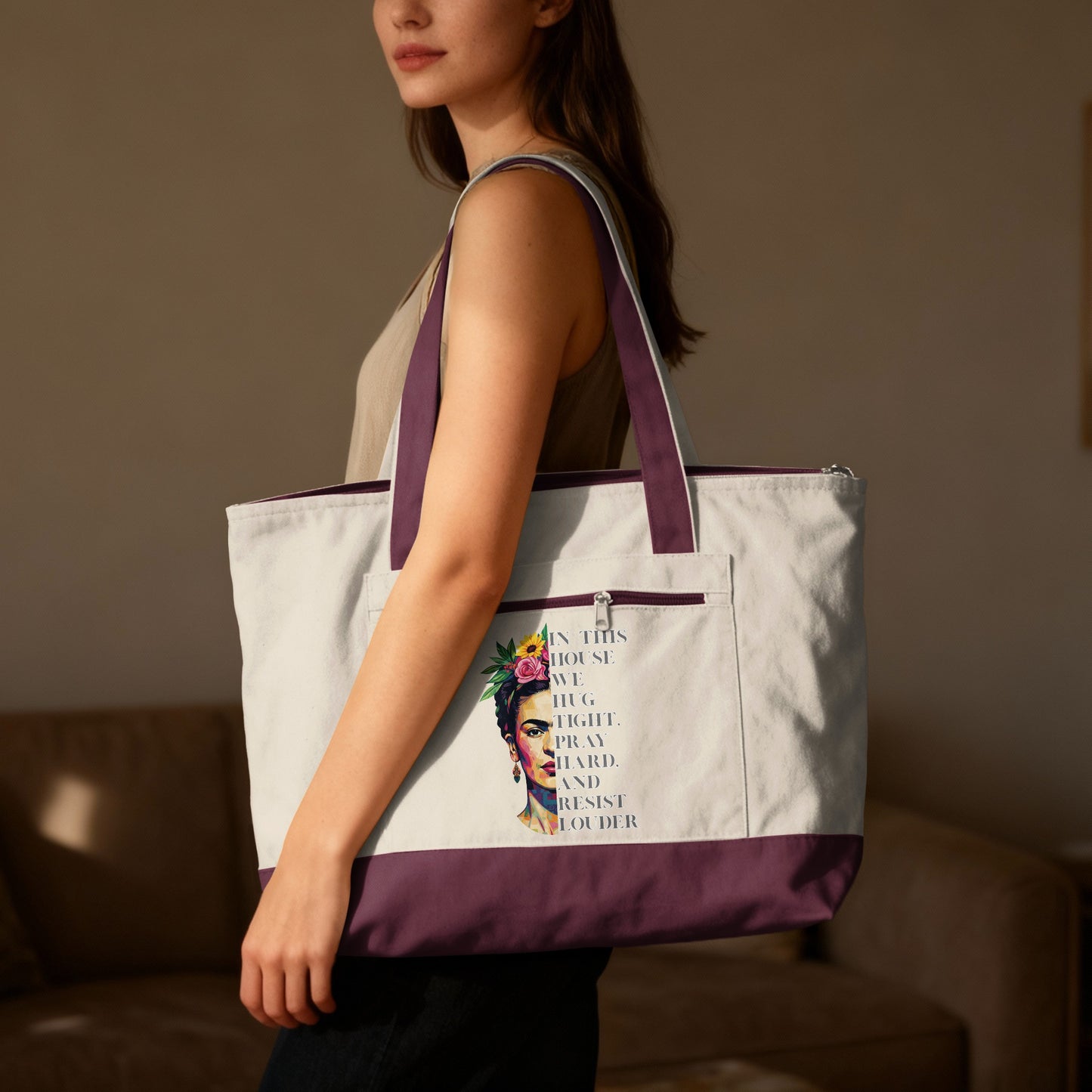 Tote bag with Frida Kahlo illustration and quote "In this house we hug fight pray hard and resist louder."