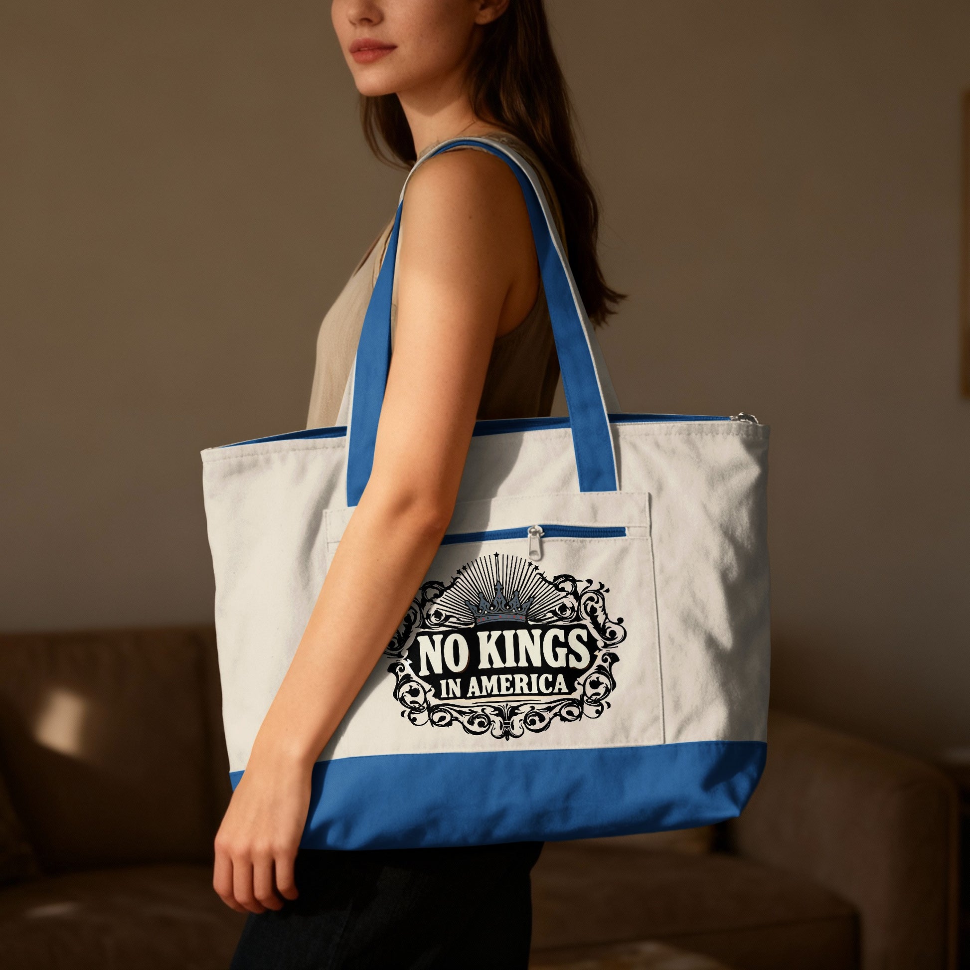 Woman wearing white tote bag with "No Kings In America" text and crown design.