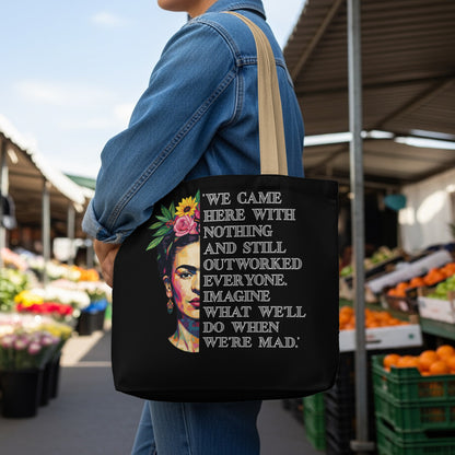 Black tote bag featuring Frida Kahlo artwork and an empowering quote.