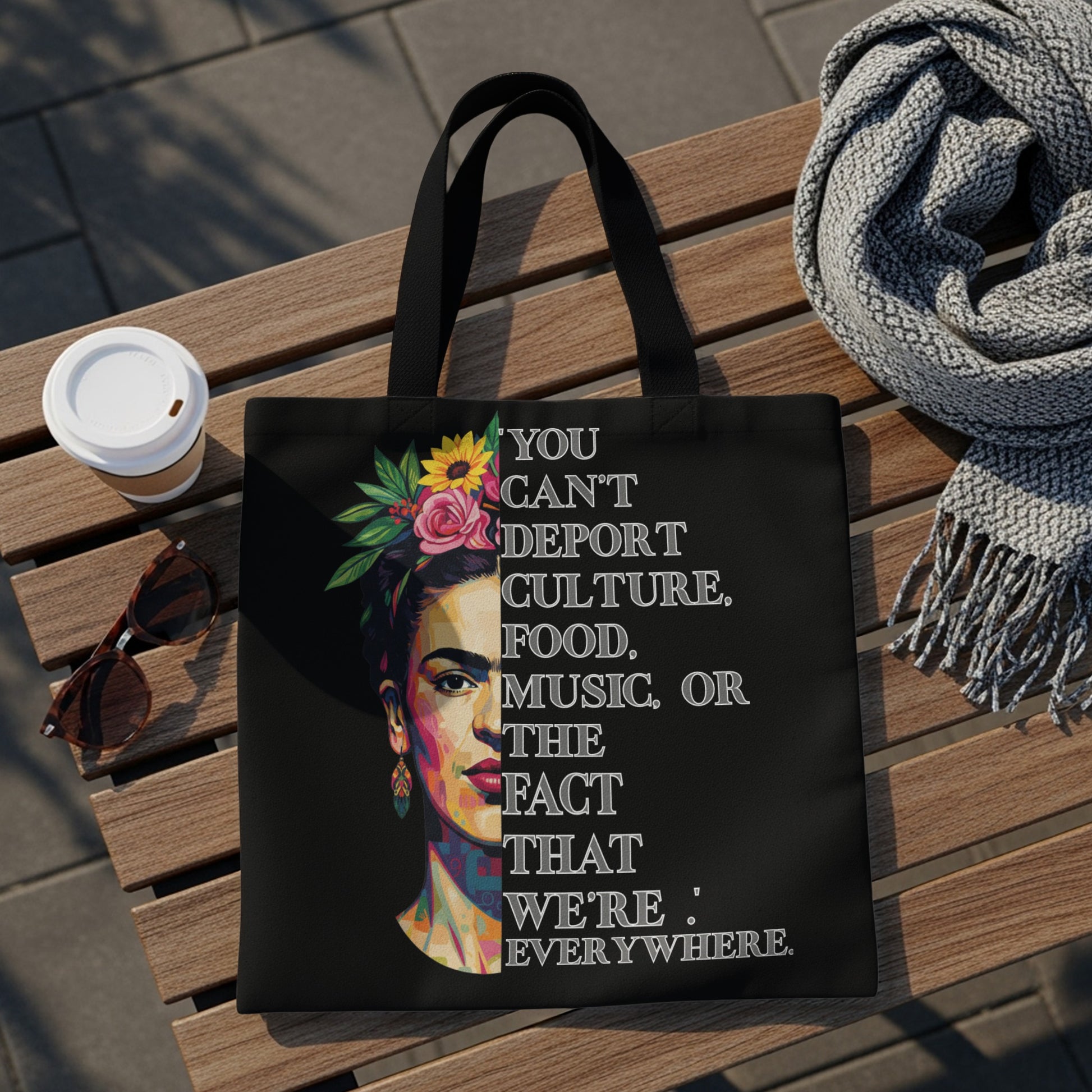 Black tote bag with Frida Kahlo portrait and quote "You can't deport culture...".