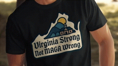 a black t-shirt with a graphic design on it, which includes a mountain and a house. The text on the t-shirt reads "Virginia Strong Not MAGA Wrong".
