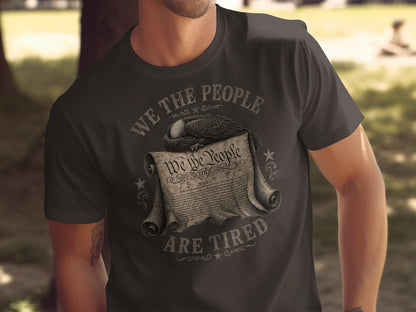T-shirt with "WE THE PEOPLE ARE TIRED" and an eagle over the Constitution.