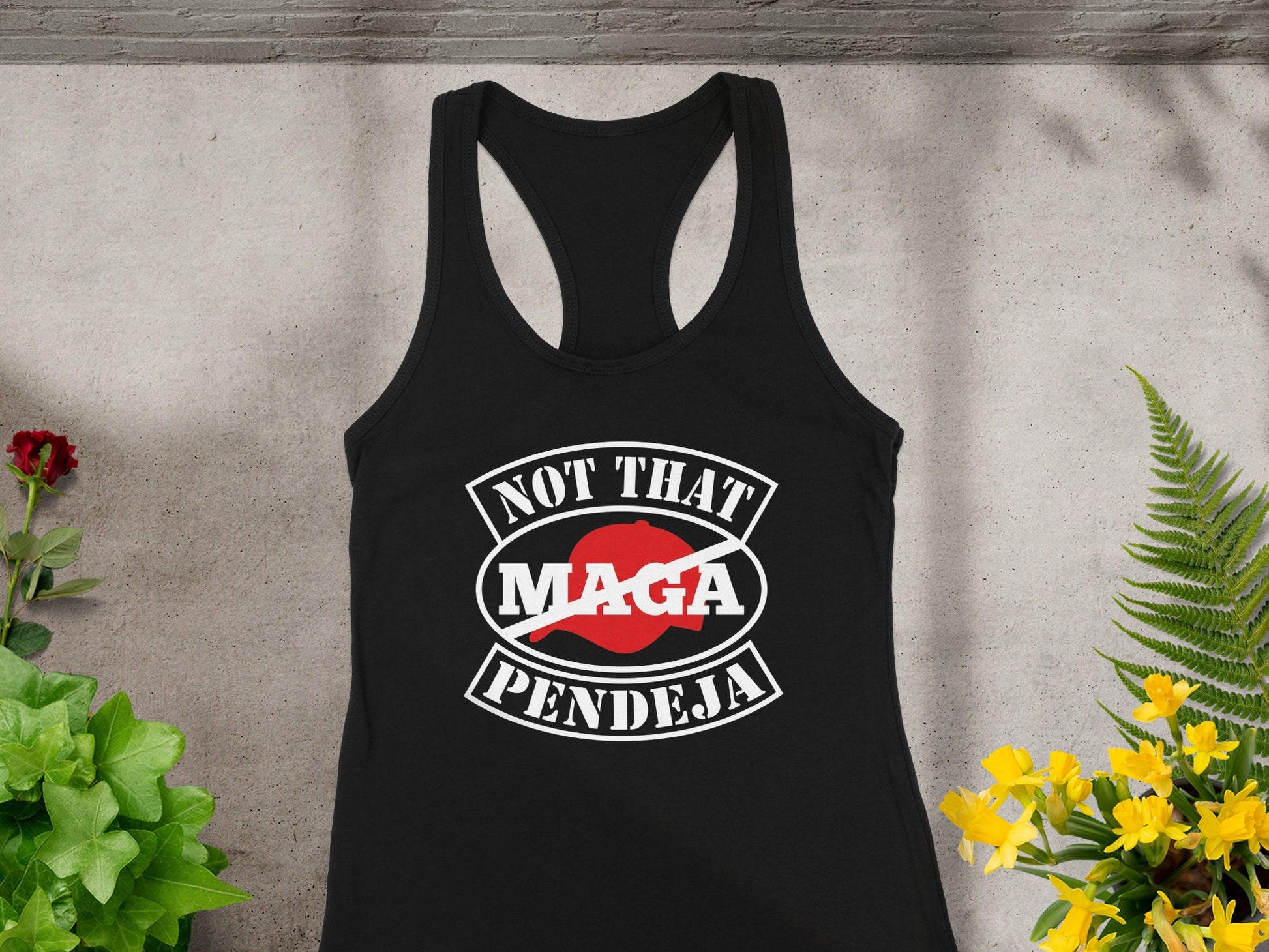 Black tank top with "NOT THAT MAGA PENDEJA" text and crossed out MAGA hat.