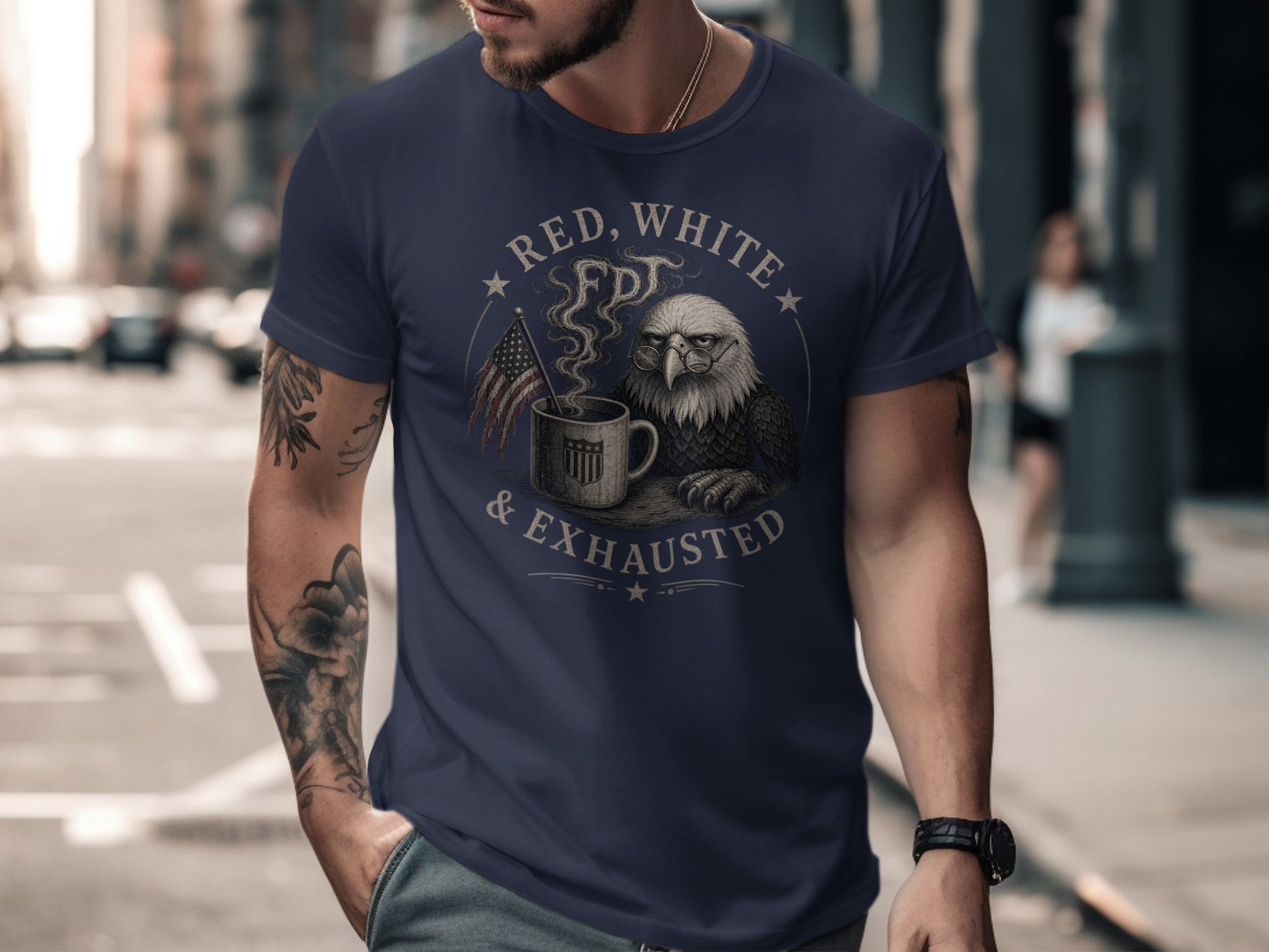 Man wearing navy t-shirt with eagle, coffee mug, and "Red, White & Exhausted" text.