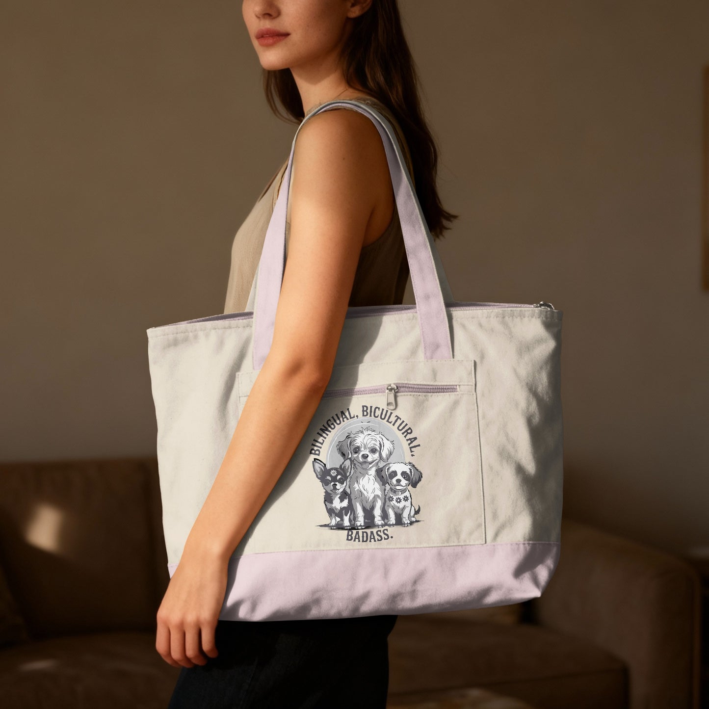 Woman holding large tote bag with three dogs and "Bilingual, Bicultural Badass" text.