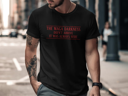 Black t-shirt with red text "The Maga Darkness Didn't Arrive It Was Always Here".