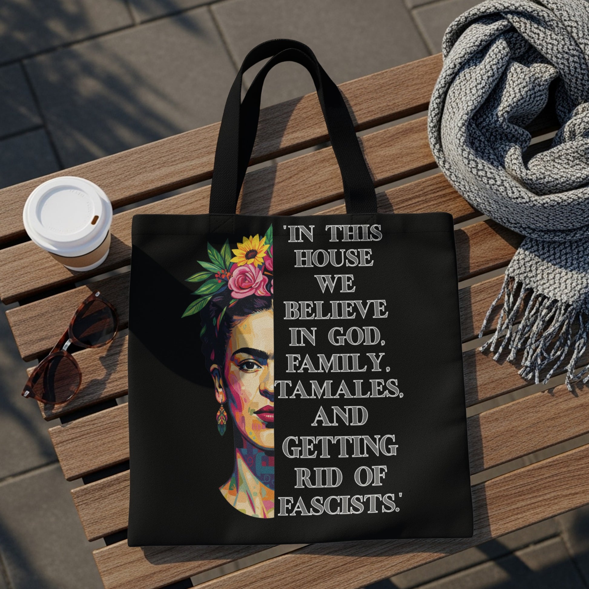 Black tote bag with Frida Kahlo artwork and quote about God, family, and tamales.