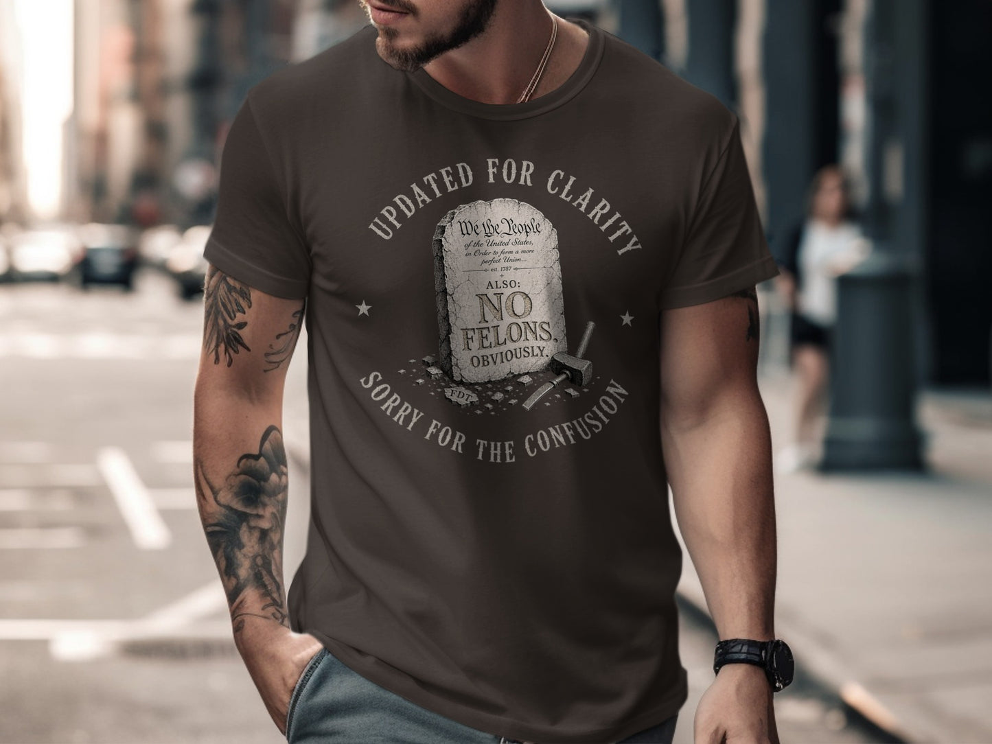 Brown t-shirt with text "Updated for Clarity, No Felons, Obviously."
