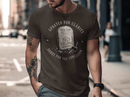 Brown t-shirt with text "Updated for Clarity, No Felons, Obviously."