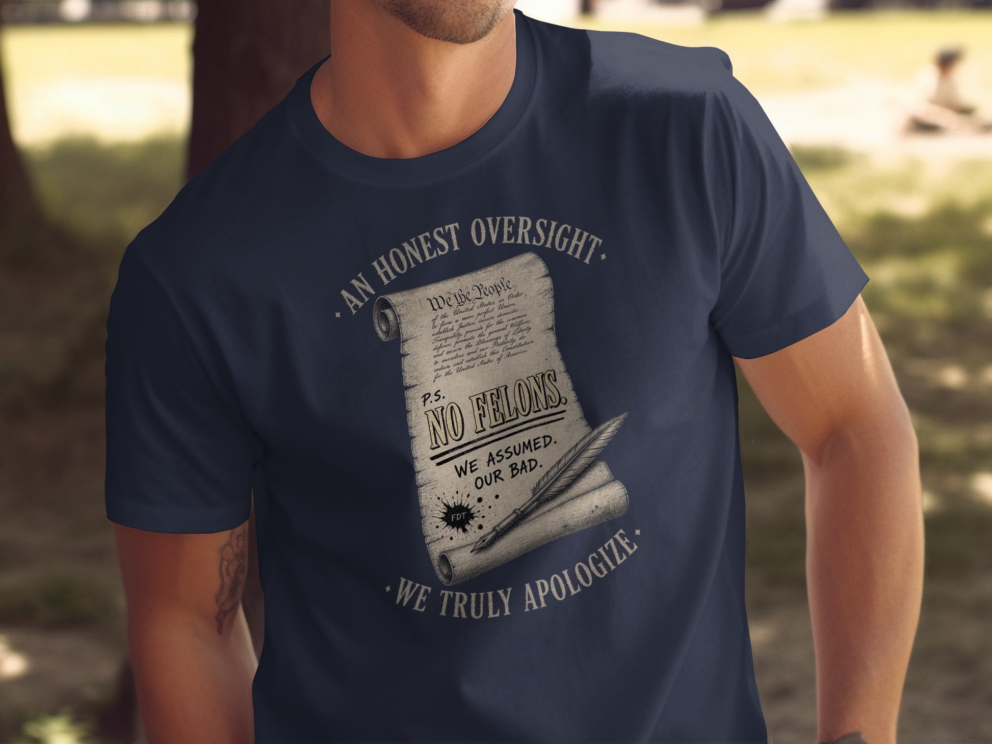 T-shirt with "We the People" text, "NO FELONS" and "WE ASSUMED. OUR BAD."