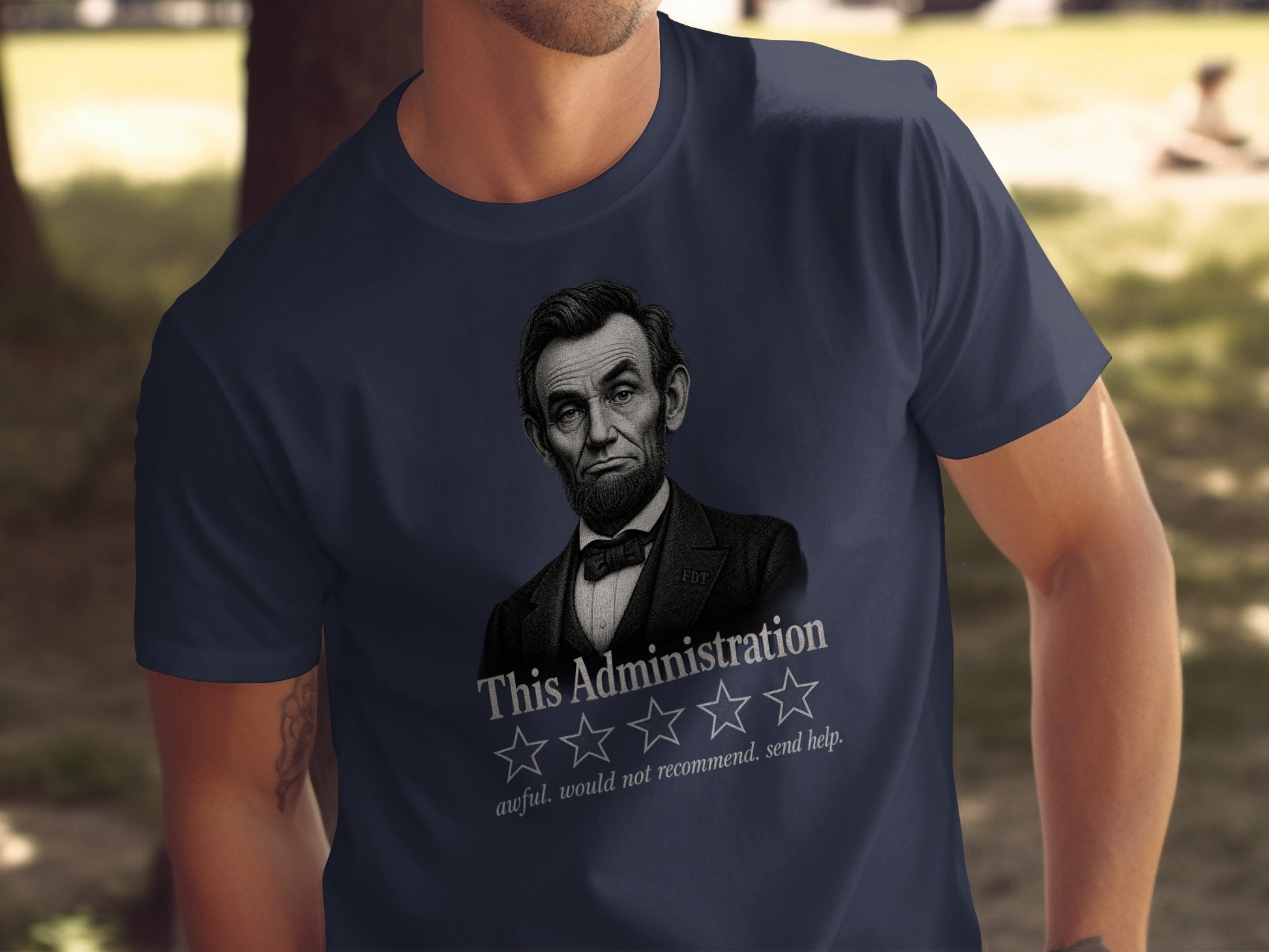 Abraham Lincoln on navy t-shirt with "This Administration" and five rating stars.