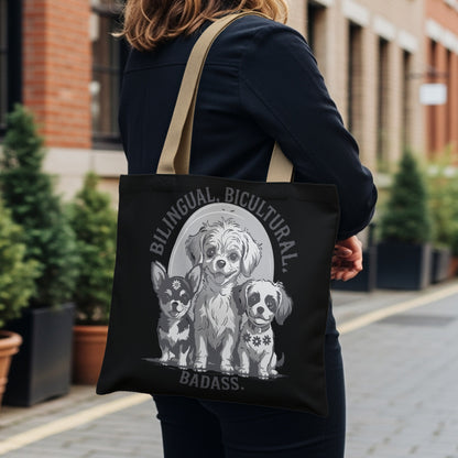Black tote bag with "Bilingual. Bicultural. Badass." text and three chihuahua dogs.