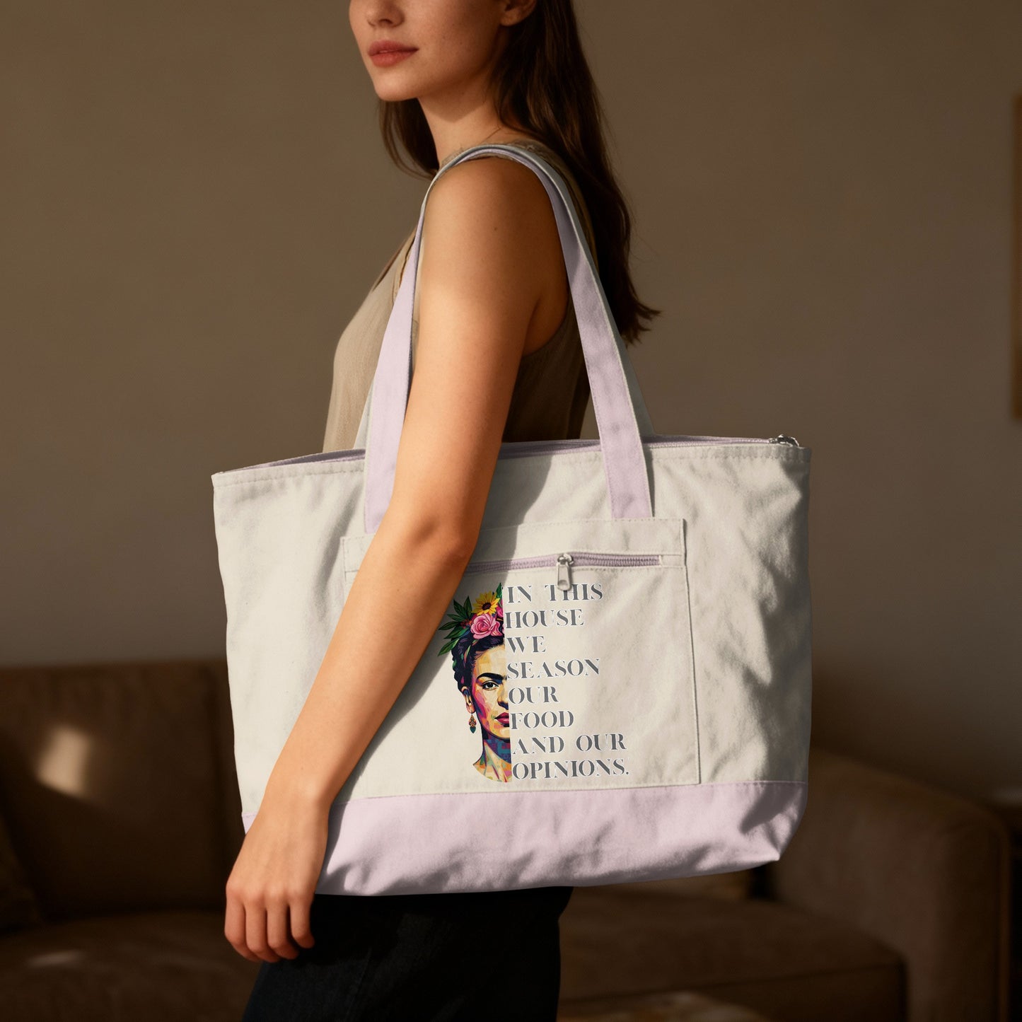 Tote bag with Frida Kahlo portrait and "In this house we season our food and our opinions" text.