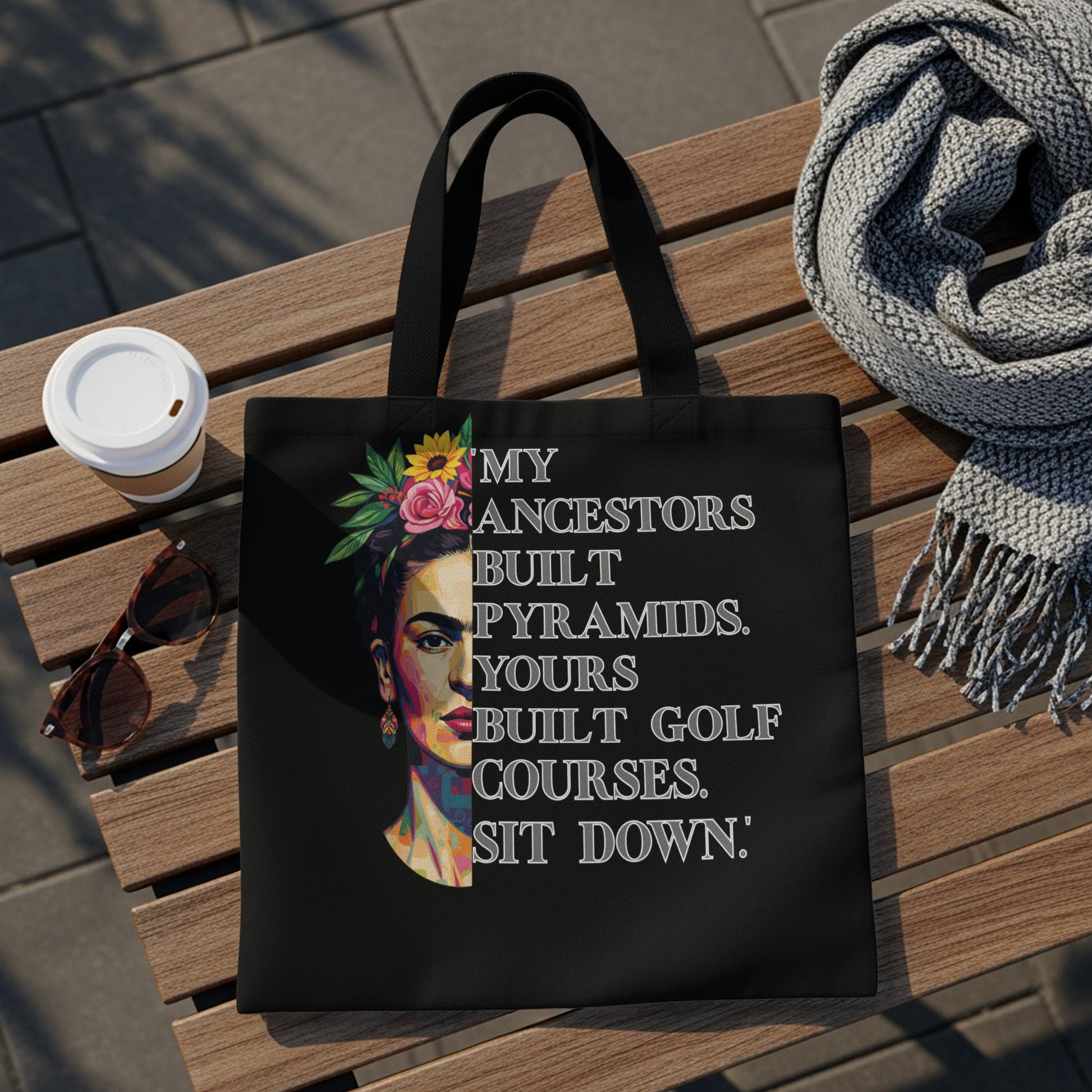 Tote bag with Frida Kahlo portrait and text "Ancestors built pyramids, yours built golf courses."