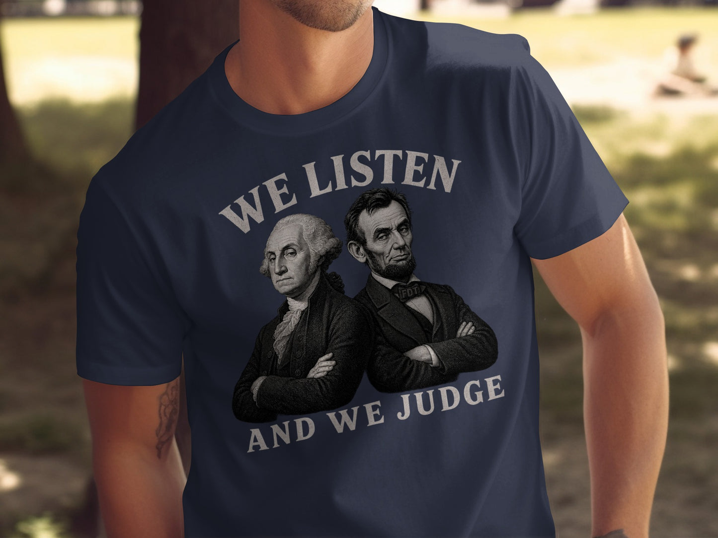 Navy t-shirt with Washington and Lincoln, saying "We Listen and We Judge."