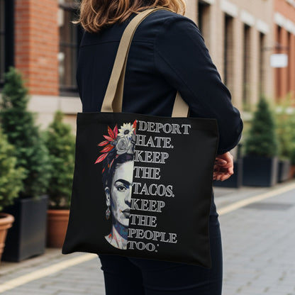 Black tote bag with Frida Kahlo portrait and text.