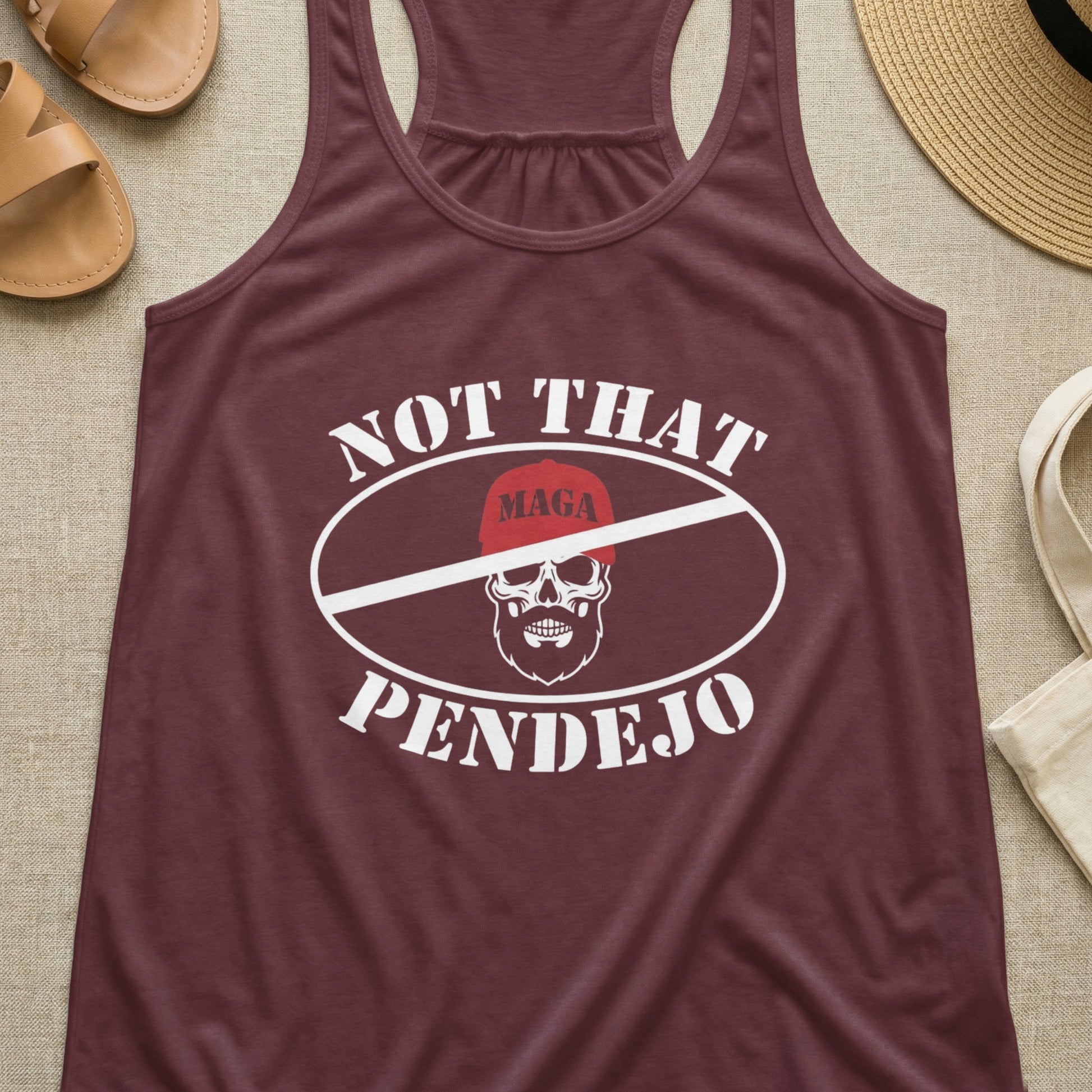 Maroon tank top with "MAGA Pendejo" text and skull graphic.