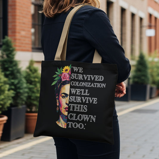 Tote bag with Frida Kahlo portrait and "WE SURVIVED COLONIZATION WE'LL SURVIVE THIS CLOWN TOO" text.
