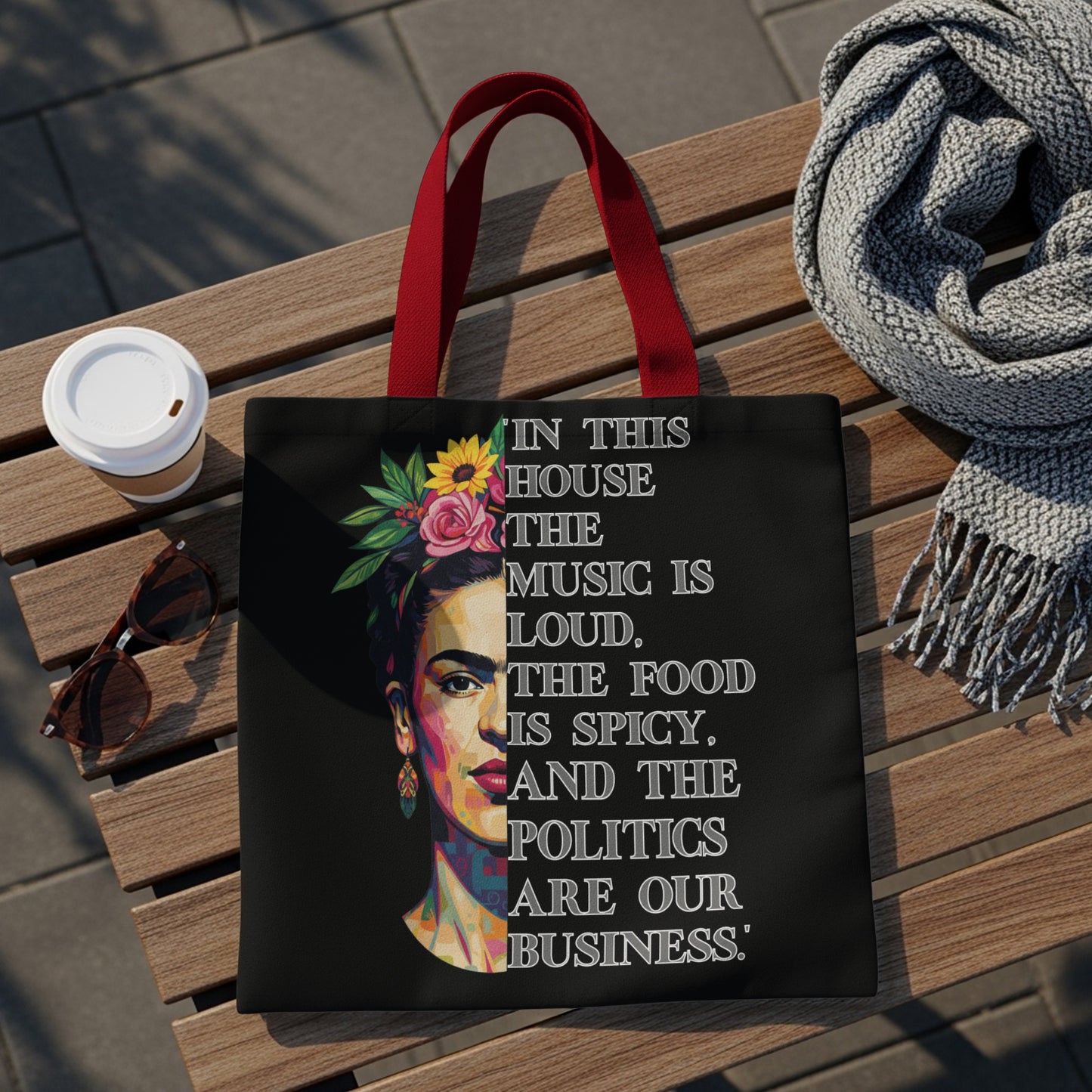 Tote bag with Frida Kahlo portrait and quote: "In this house, the music is loud. The food is spicy. And the politics are our business."