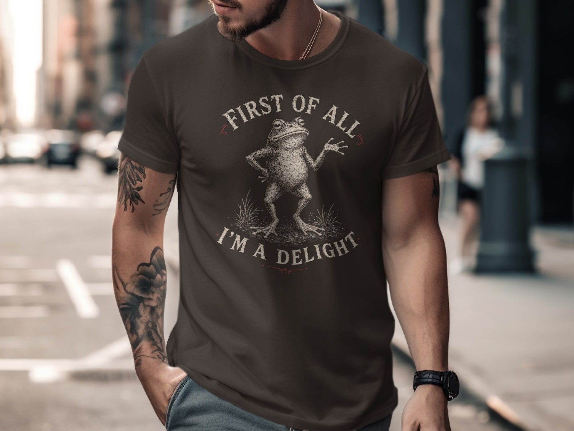 Brown t-shirt with a frog illustration and text "First of all, I'm a delight."