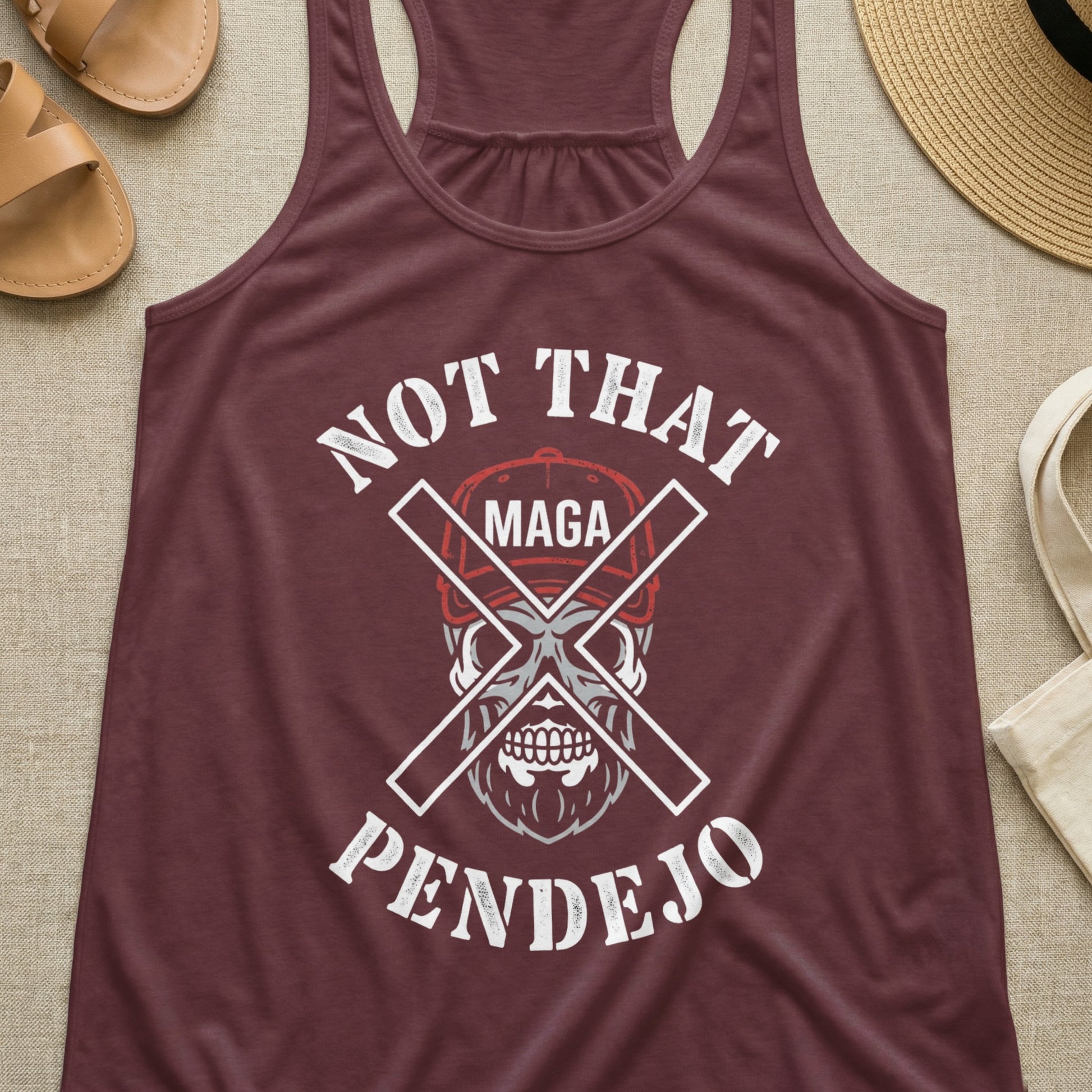 Burgundy tank top with skull graphic and text "Not That MAGA Pendejo".