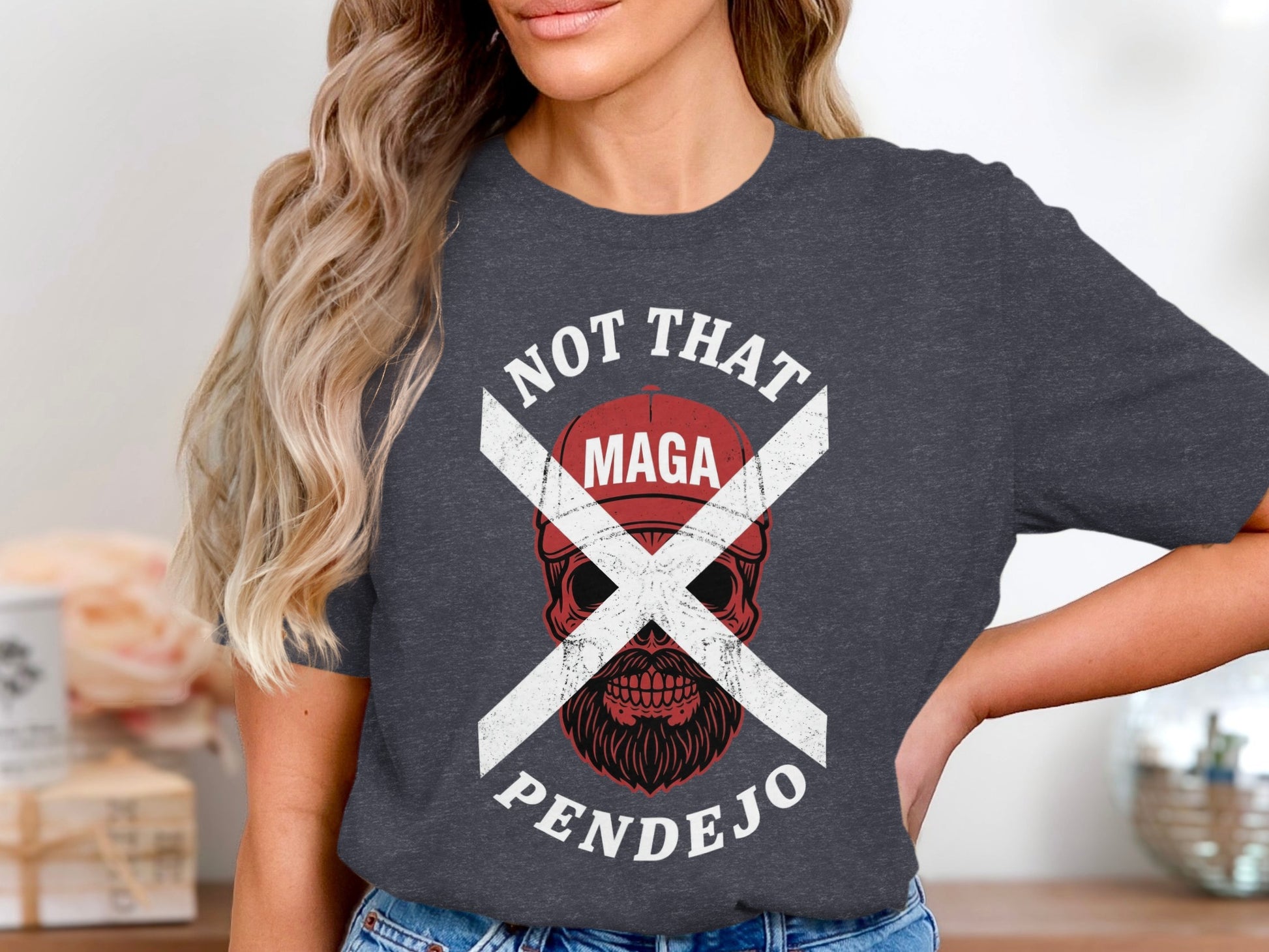 Dark t-shirt with white text and a skull graphic reading "NOT THAT MAGA PENDEJO".