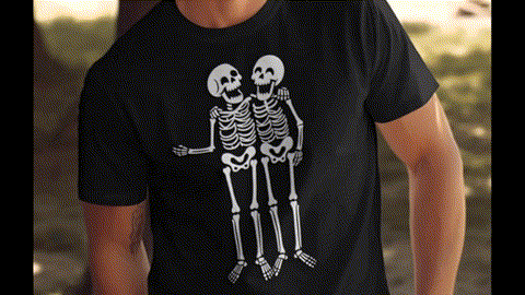 A black t-shirt with a graphic design of two smiling skeleton figures embracing each other.