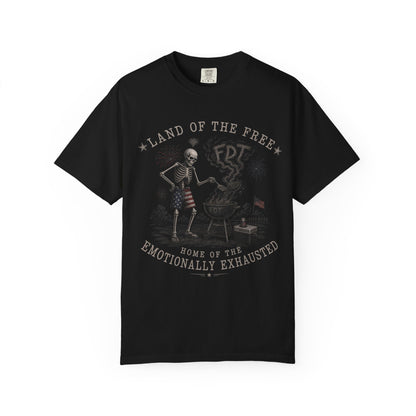 Black t-shirt with patriotic skeleton grilling, "Land of the Free" and "Emotionally Exhausted" text.