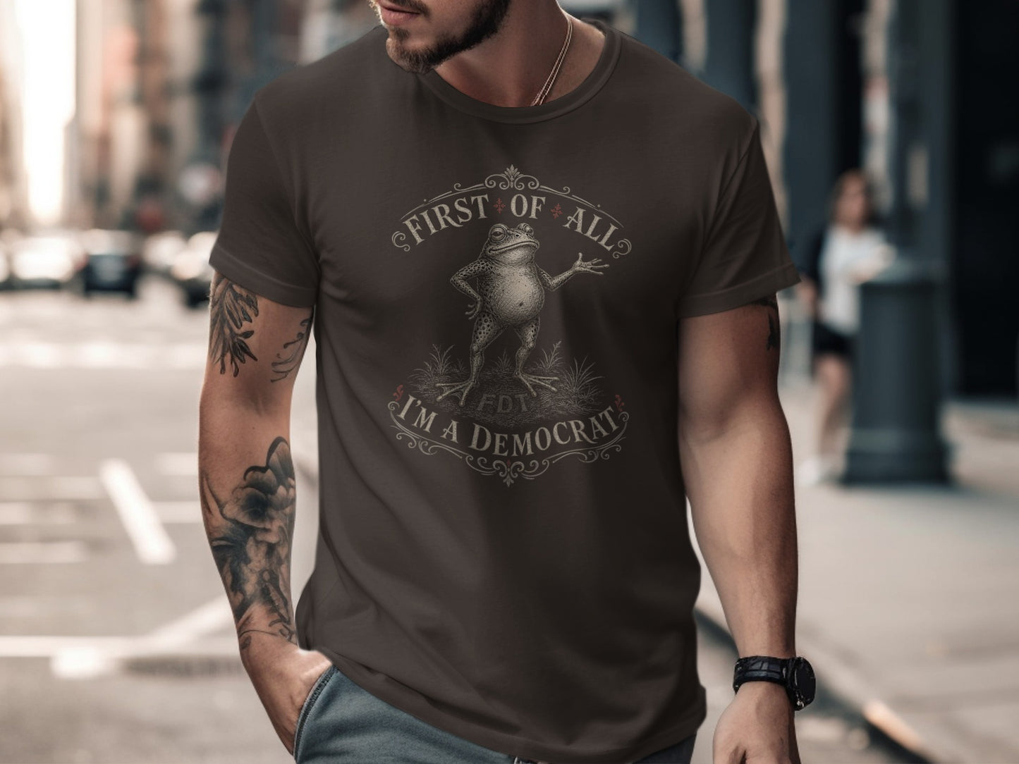 Dark brown t-shirt with "First of all, I'm a Democrat" text and a frog graphic.