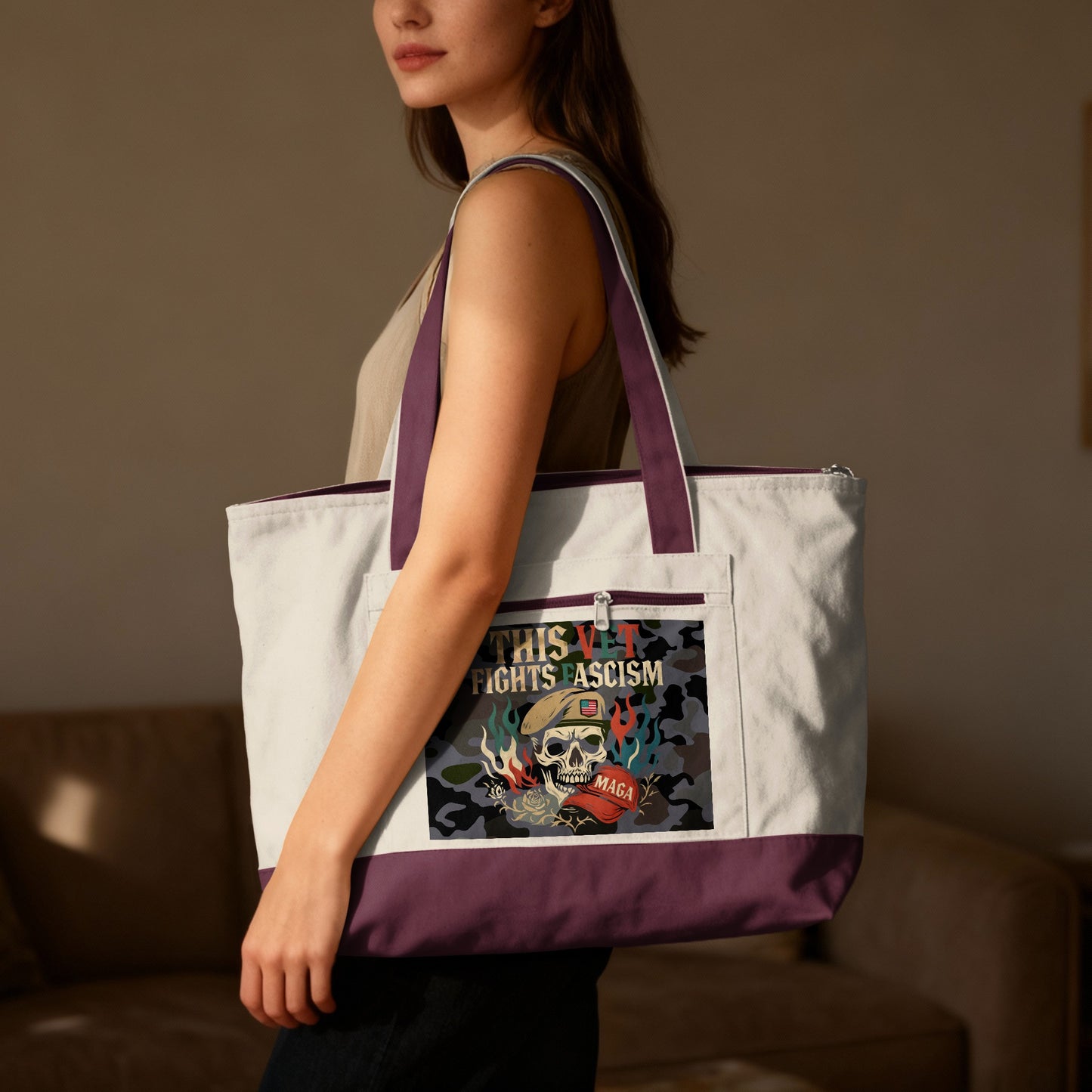 White canvas tote bag with "THIS FIGHTS FASCISM" skull graphic and purple accents.