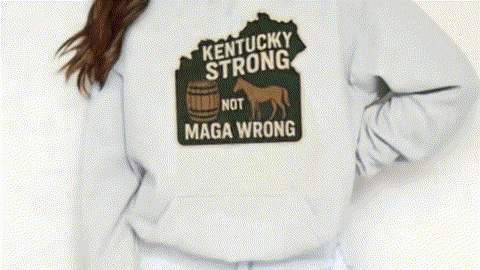 A white sweatshirt with a graphic design on the front, featuring a horse and the text "Kentucky Strong Not MAGA WRONG".