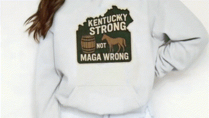 A white sweatshirt with a graphic design on the front, featuring a horse and the text "Kentucky Strong Not MAGA WRONG".