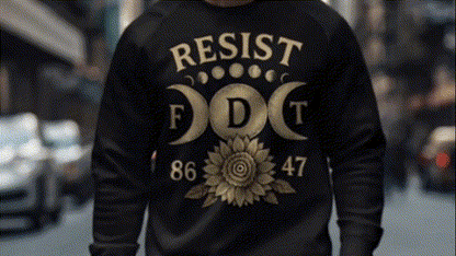 A person wearing a black sweatshirt with a large graphic design on the back.