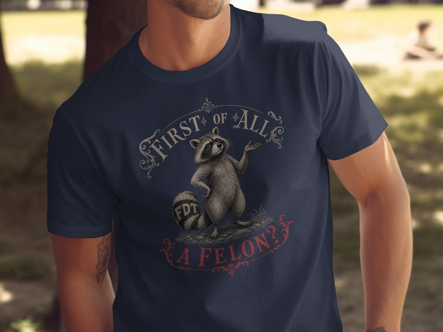T-shirt graphic with raccoon and text "FIRST OF ALL, A FELON?".